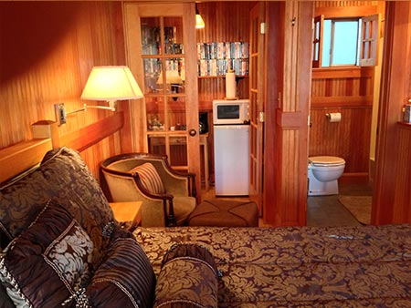 Honeymoon Suite with french doors and movie collection , microwave and fridge in lincoln city